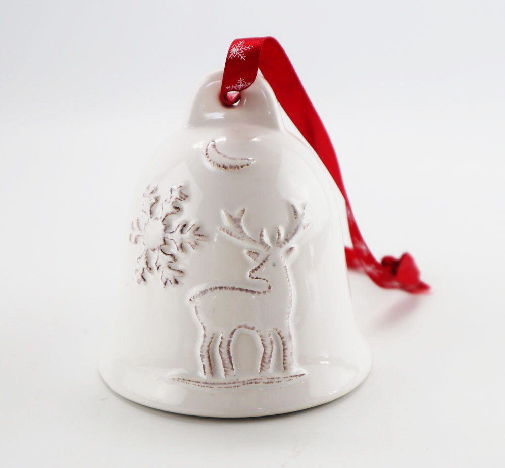 Embossed design with antiqued white glazed finish table bell