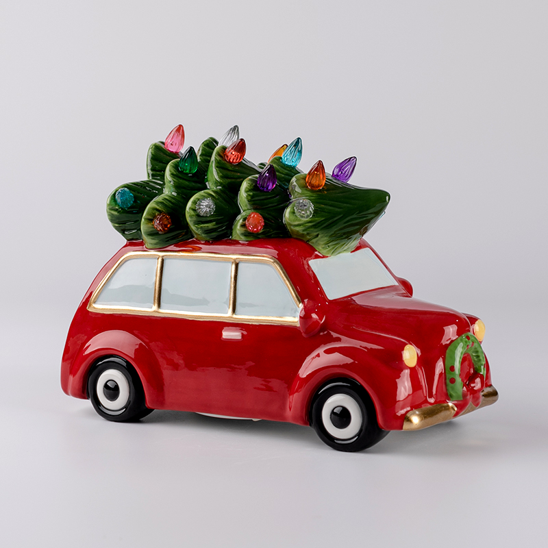 Ceramic christmas car with small lighted christmas tree ornament