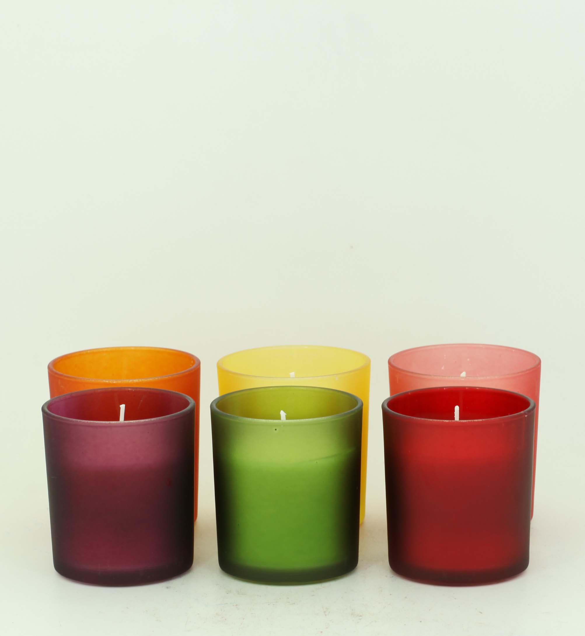 Scented candle in a painted glass candle holder