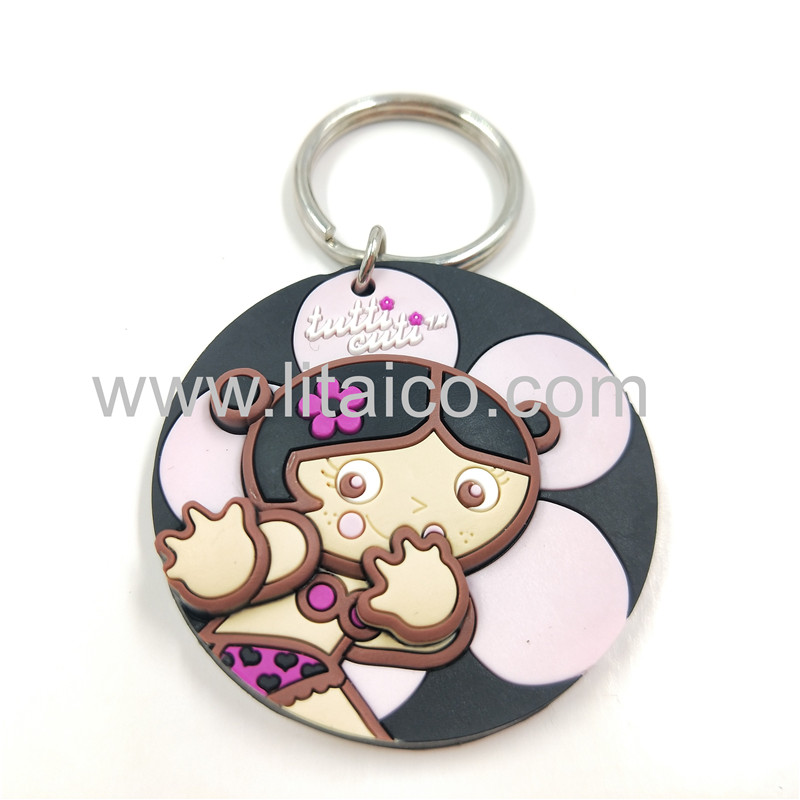 Round pink flower doll with black background PVC Keychain