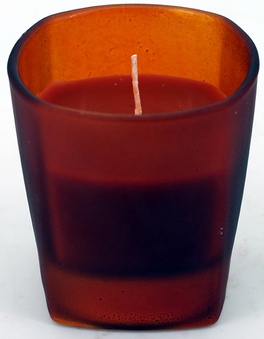 scented candle in a glass candle holder