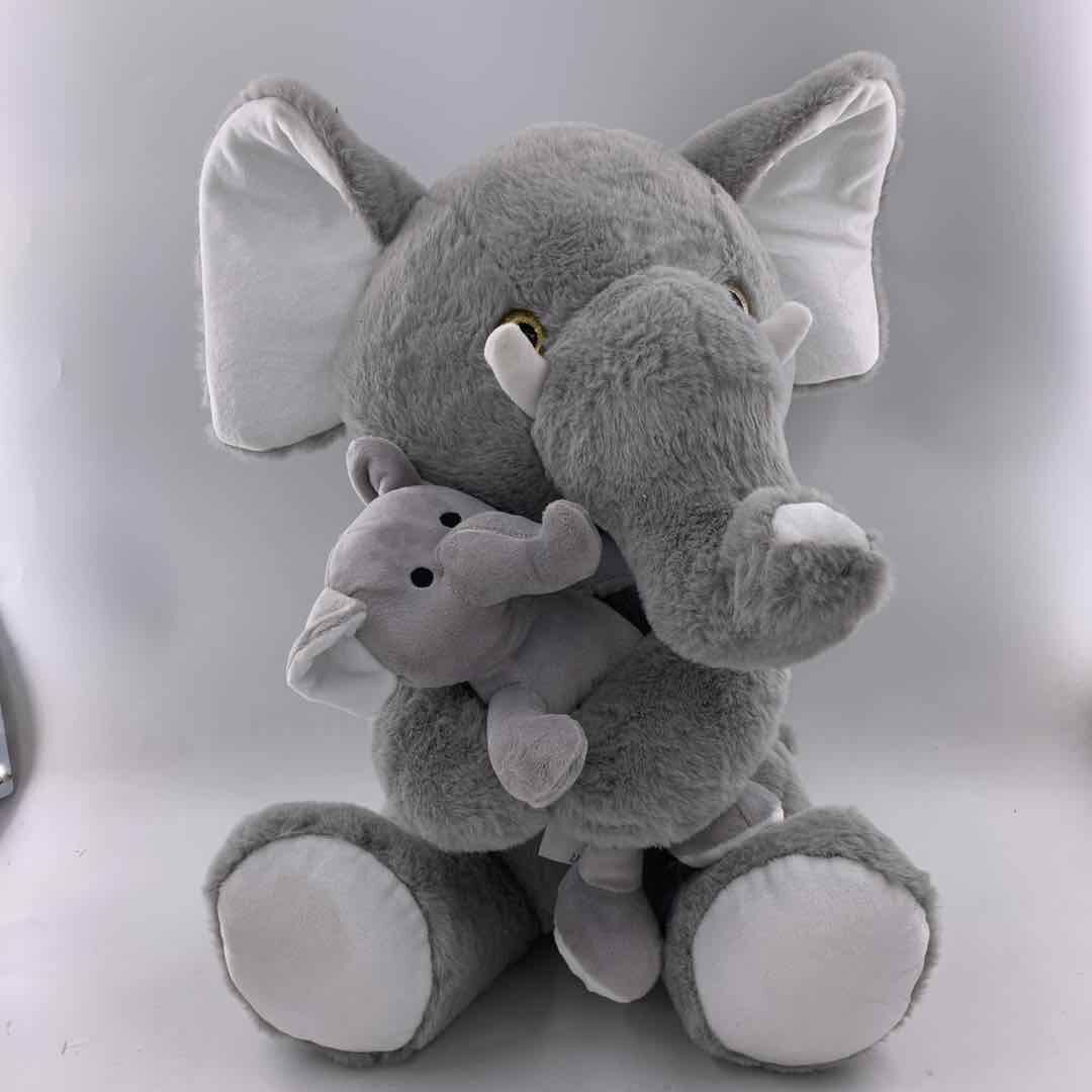 Sitting elephant with baby