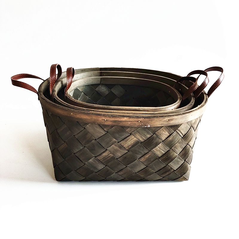 Dark brown oval chipwood basket with leather handles