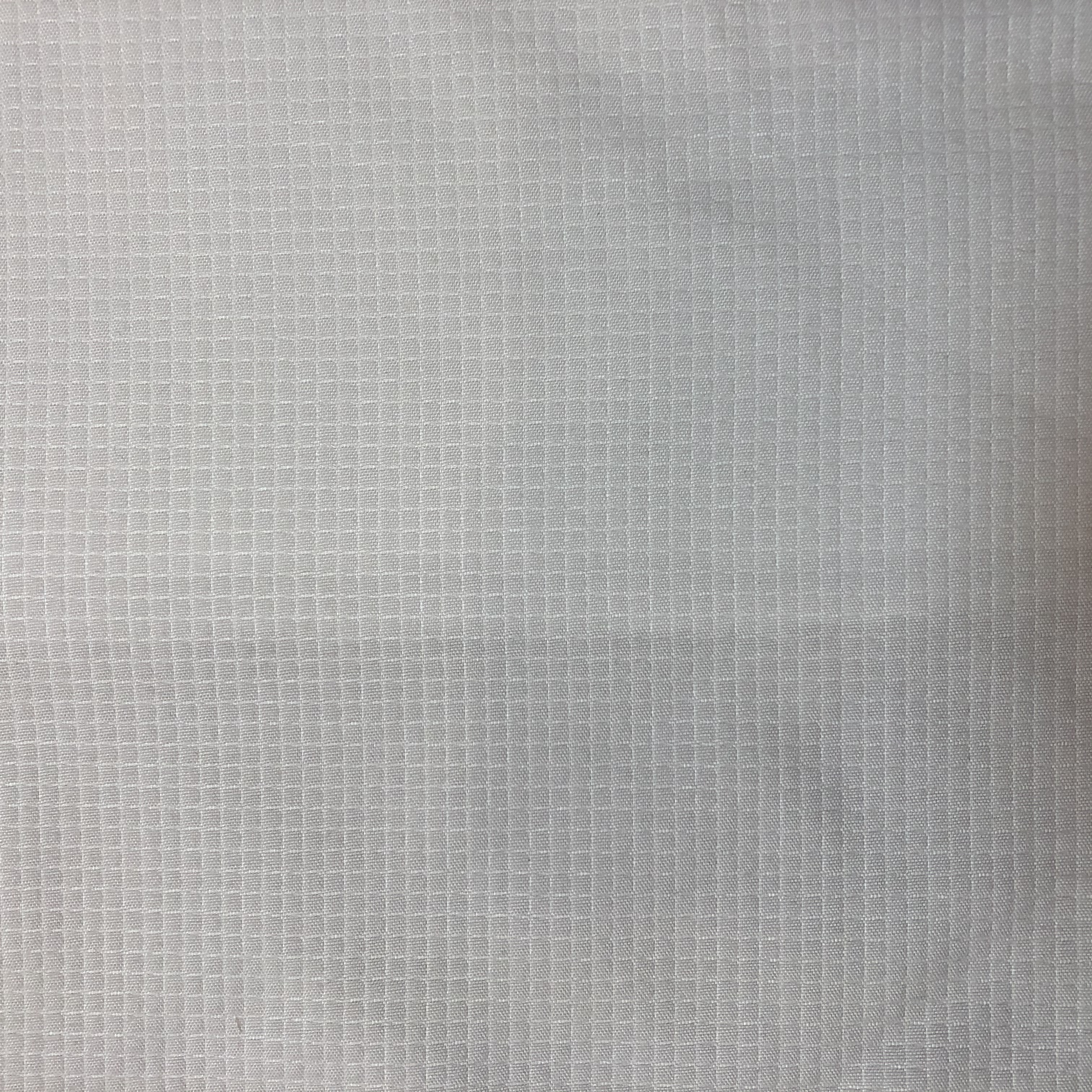 Tejido 100% poliester microfibra en relieve tenido solido