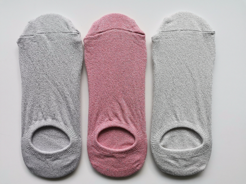 women sock with silver yarn