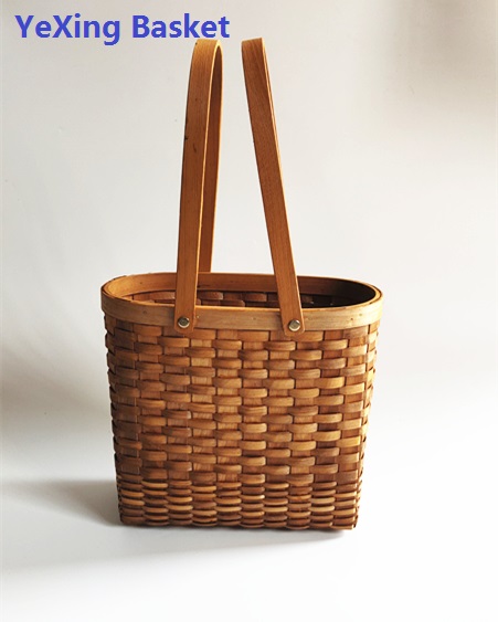 Oval dark honey color chipwood storage basket