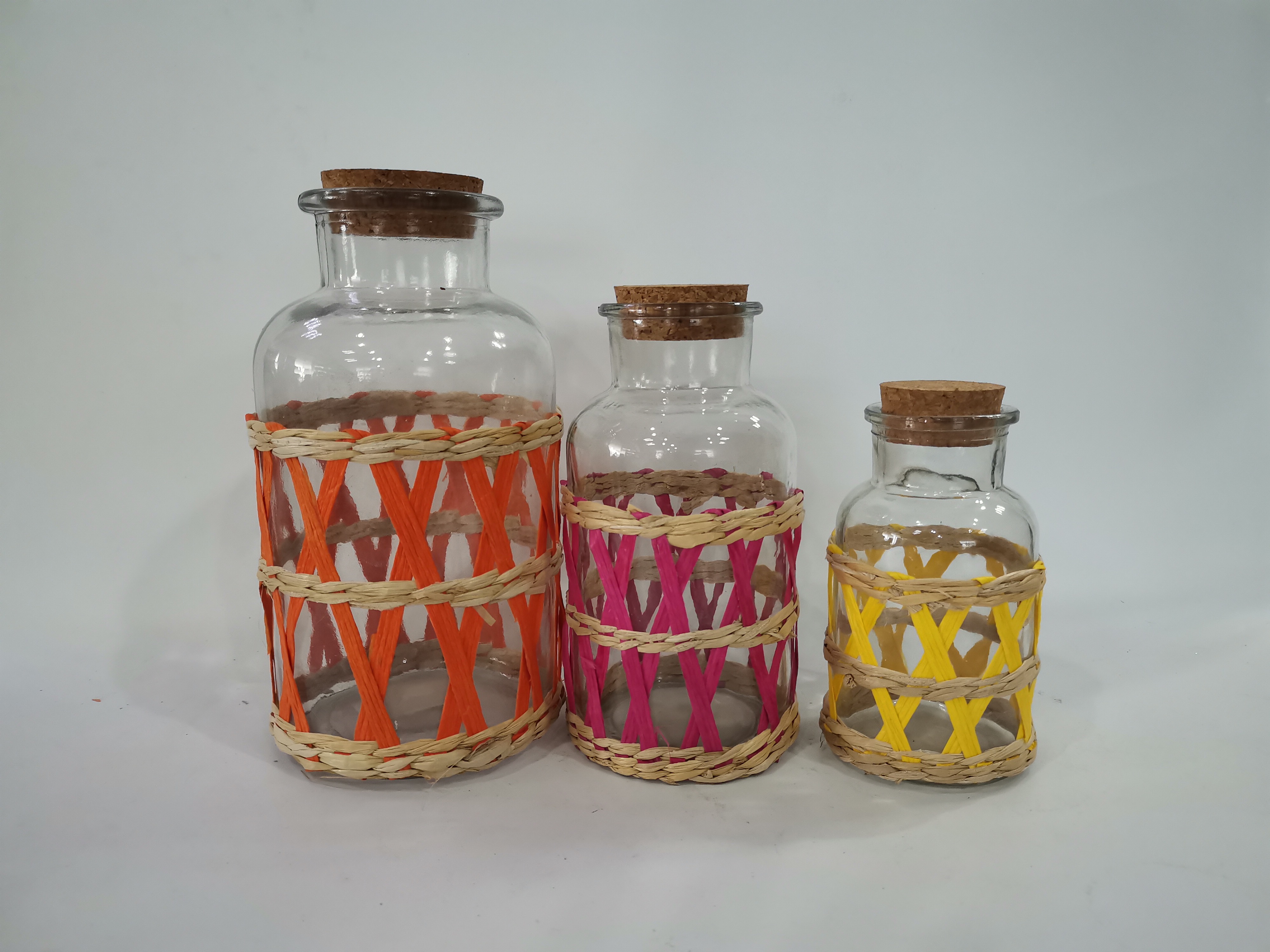 glass storage jar with cattail wrapped