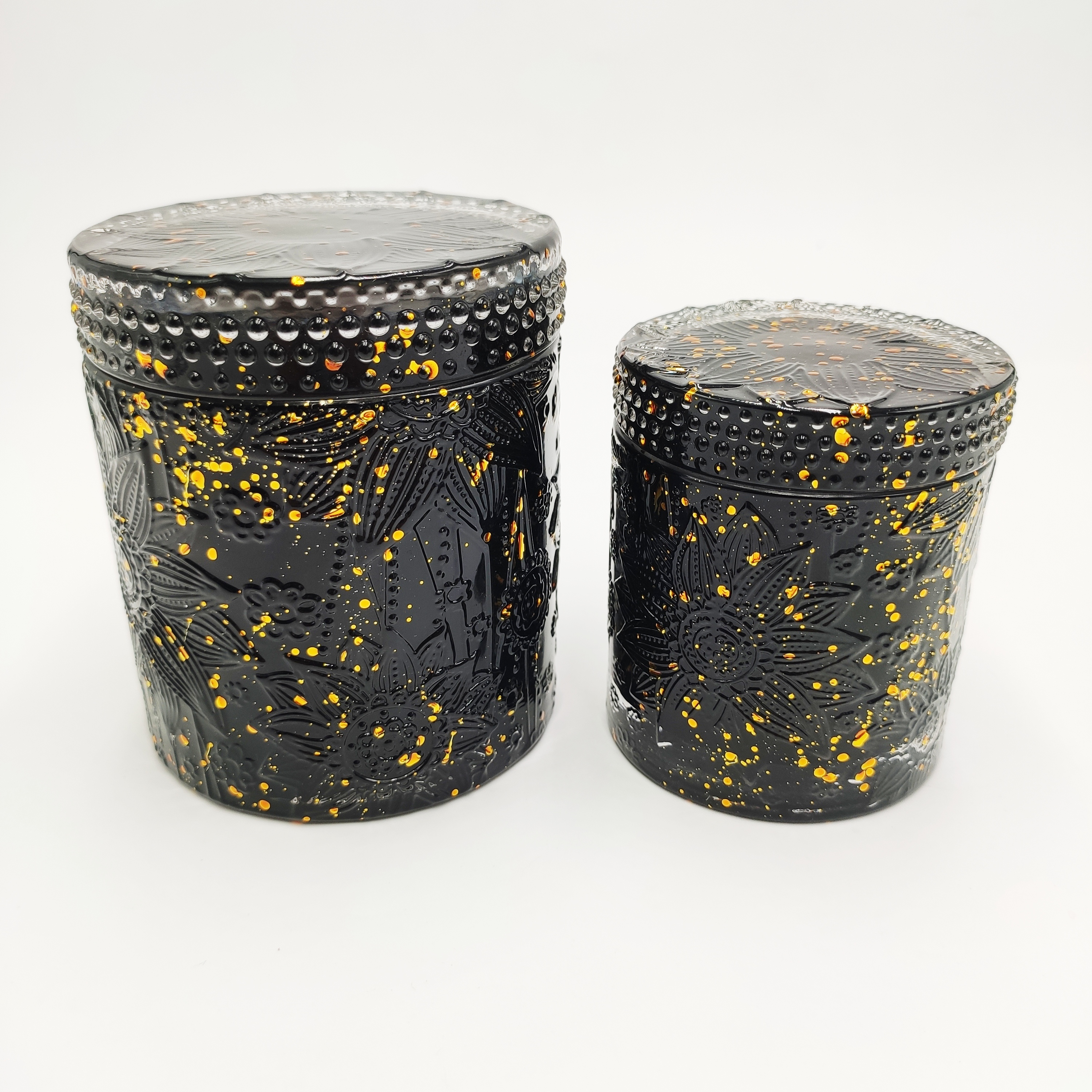 Lotus pattern glass candle jar with lid and balck color gold dots.