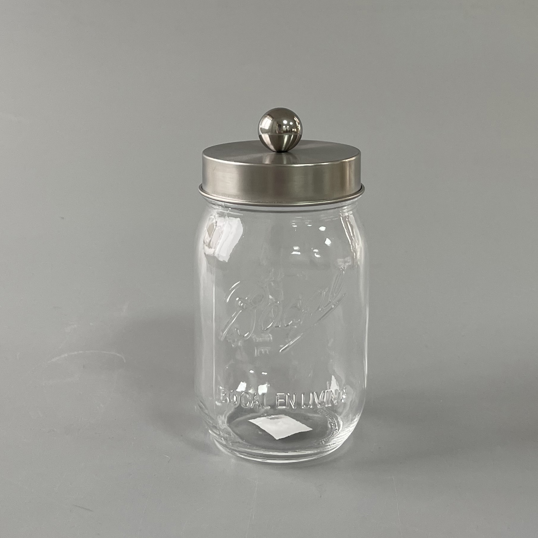 Glass jar with iron lid