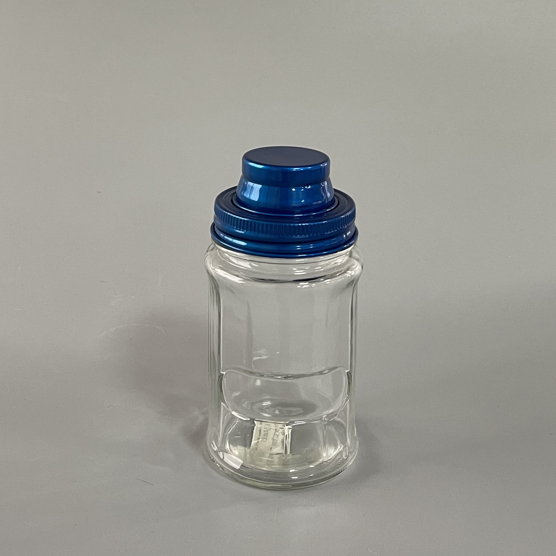 Spice glass bottle with iron lid