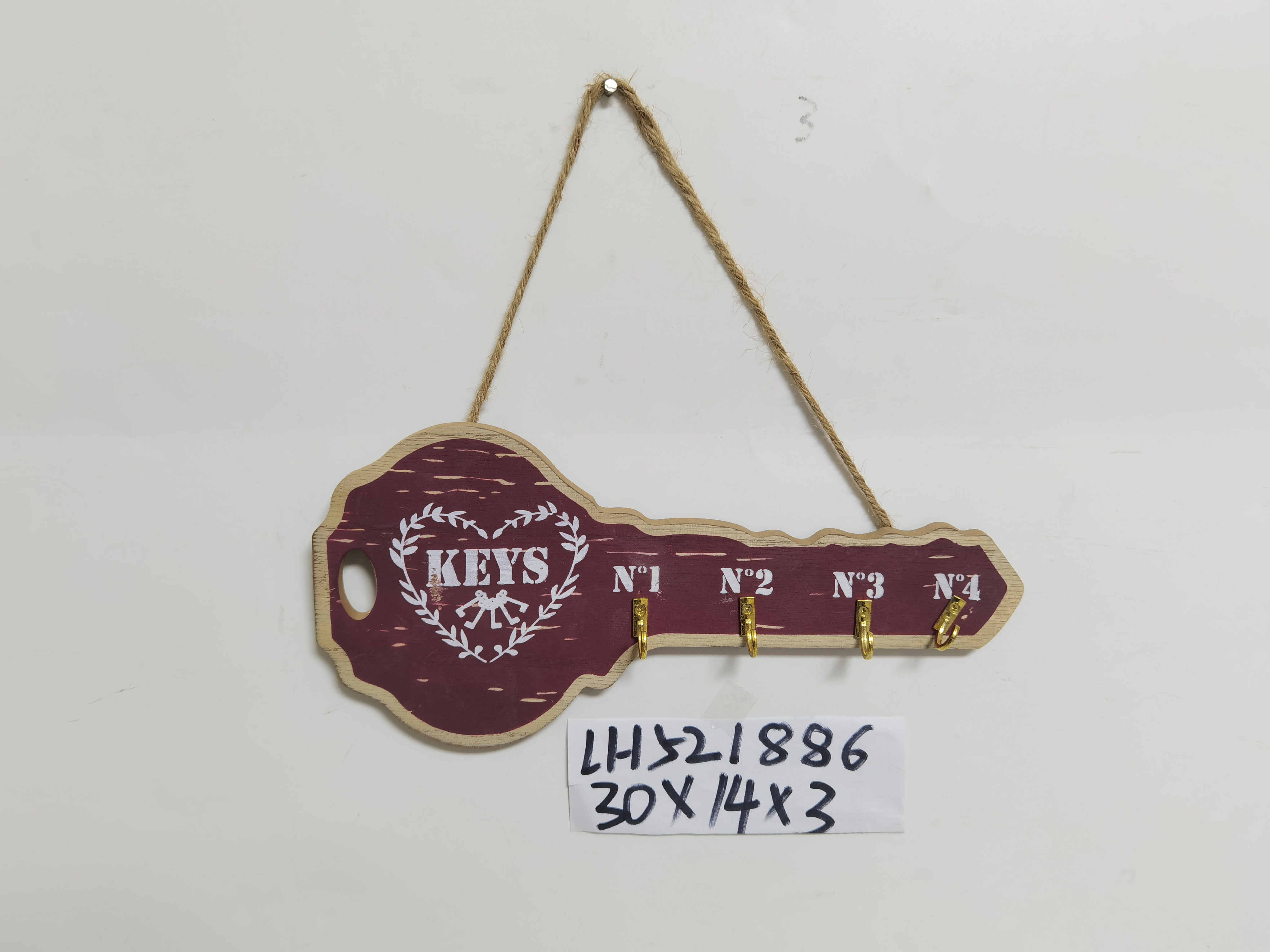Letter hook on wooden wall