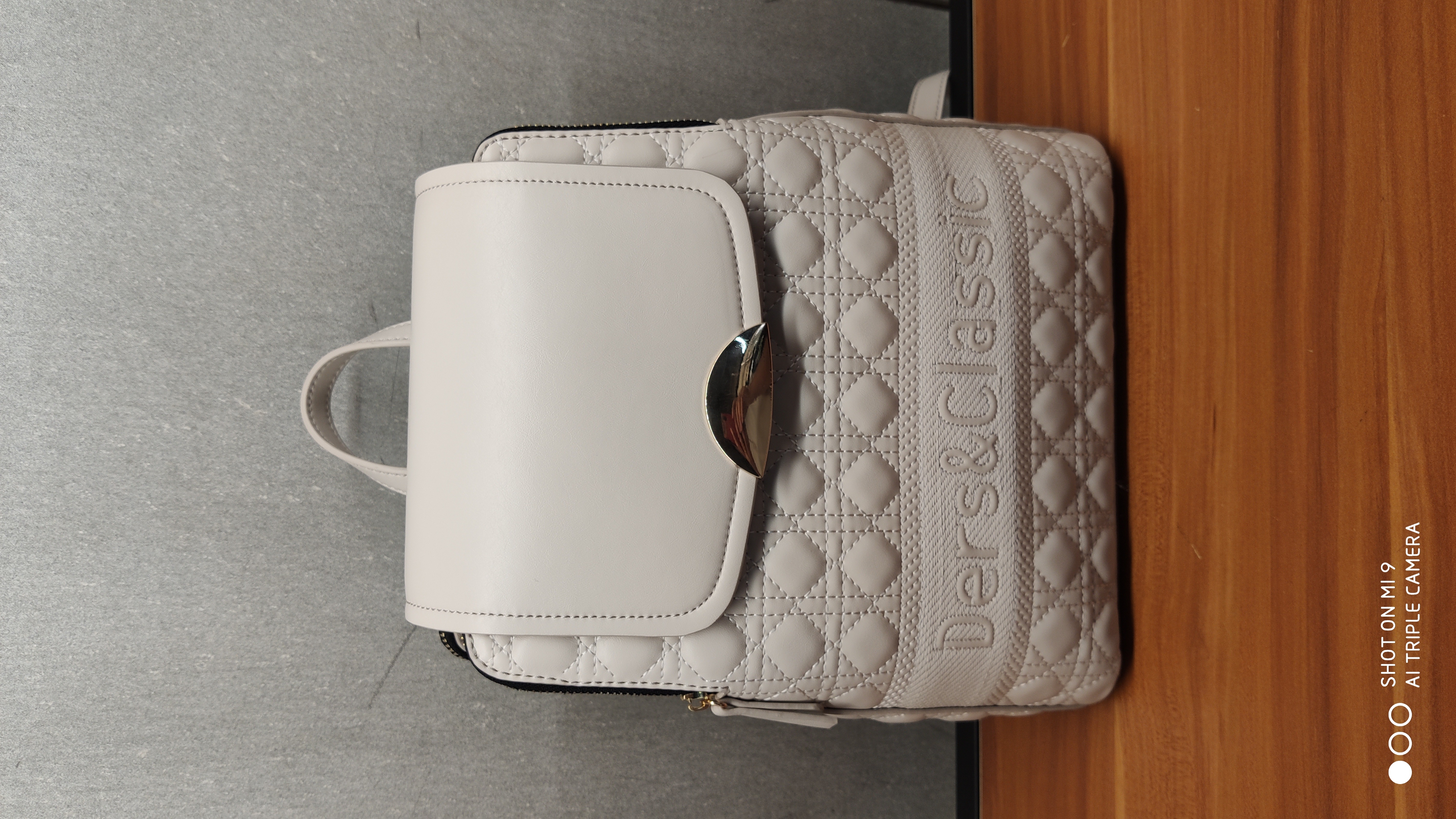 Customizable lady's backpack with PU embroidered thread