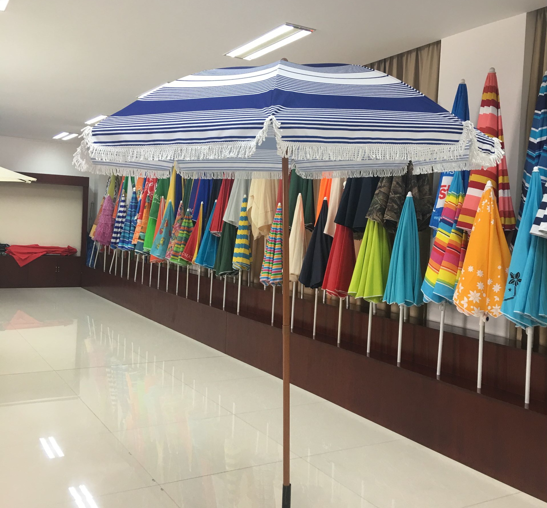 China Fantastic Luxury Tassel Wooden Promotional Outdoor Beach Parasol Umbrella with tassel