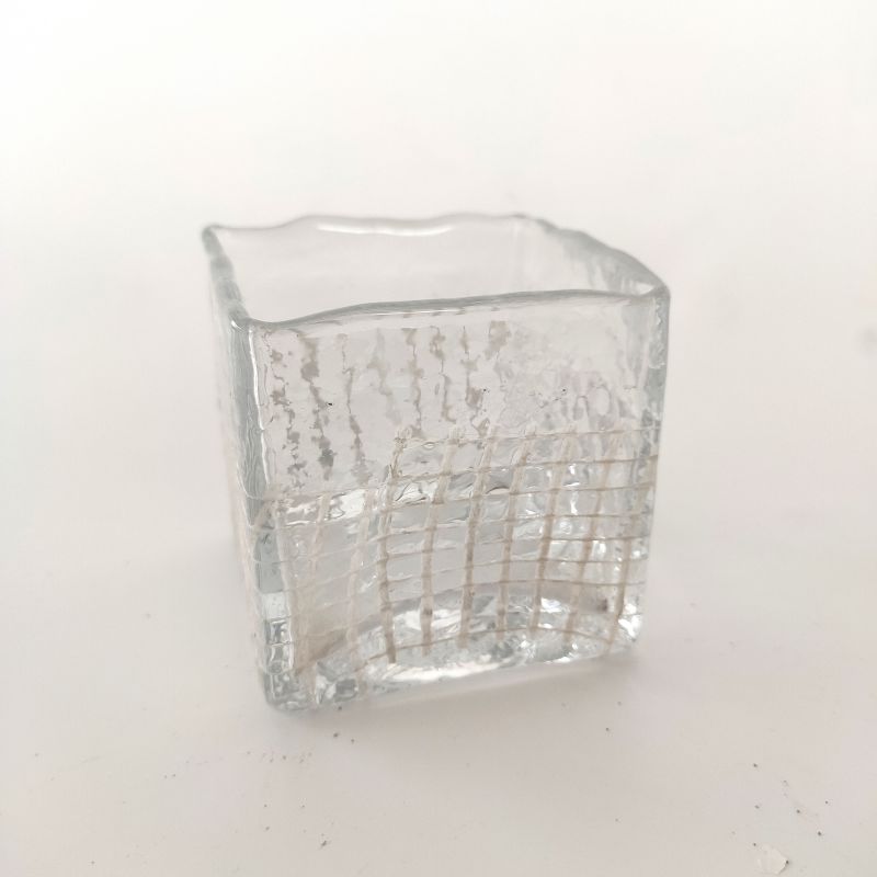Square shaped glass candle holder with meshing pattern