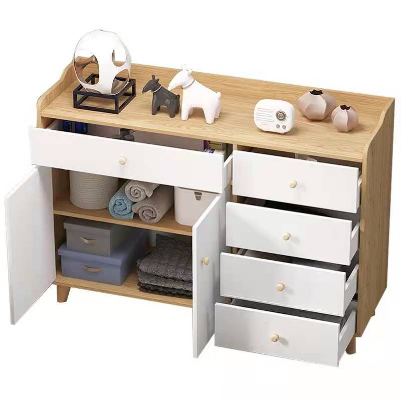 Multi-functional drawer cabinet against wall in living room