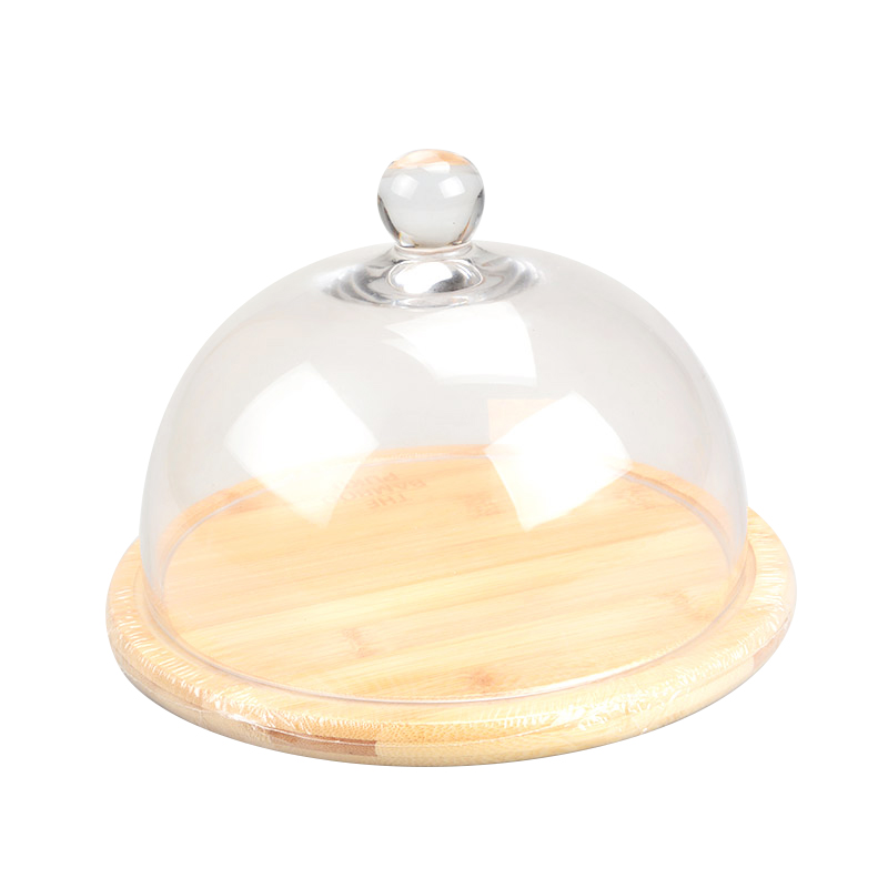 clear glass dome with wooden tray