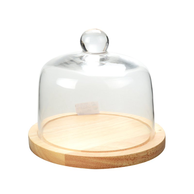 clear glass dome with wooden tray