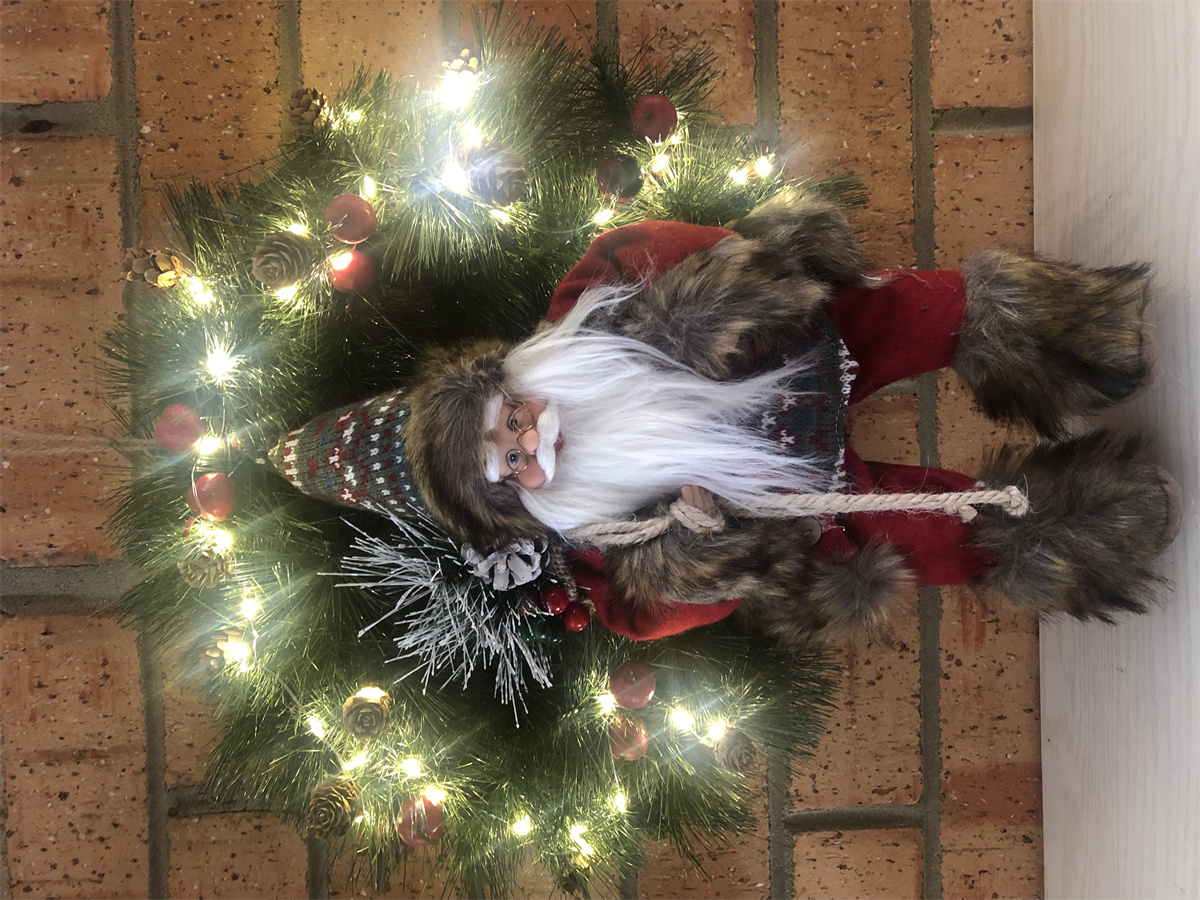 LED wreath with sitting Santa