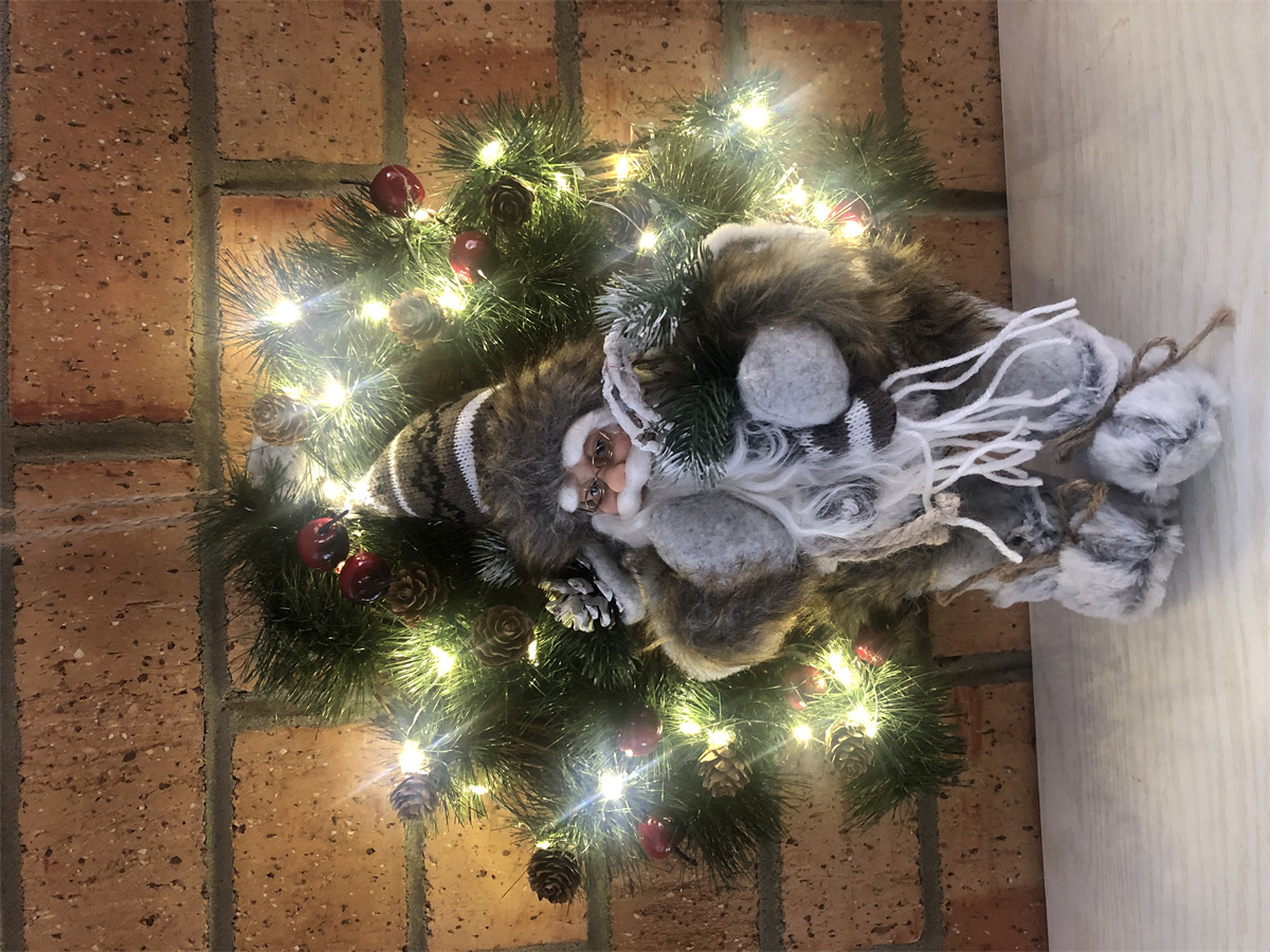 LED wreath with sitting Santa