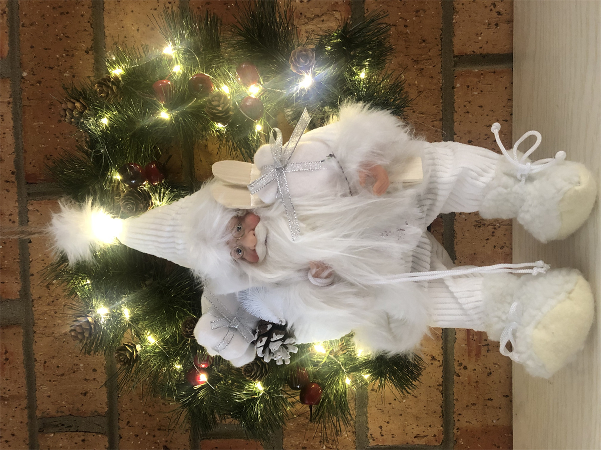LED wreath with sitting Santa