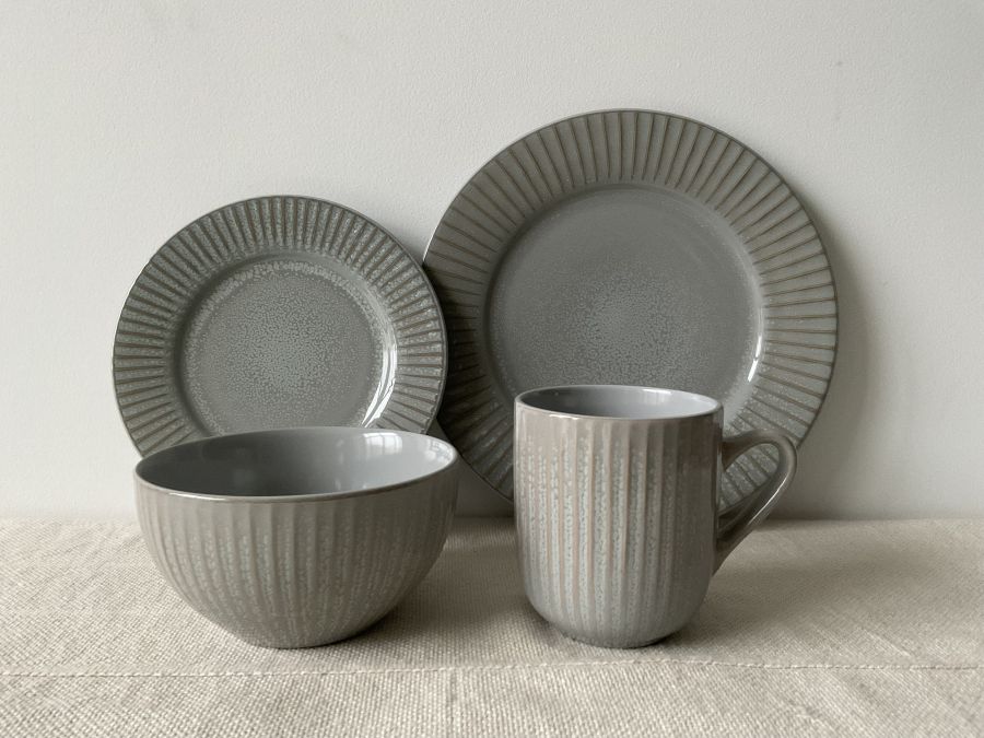 Embossed reactive glaze